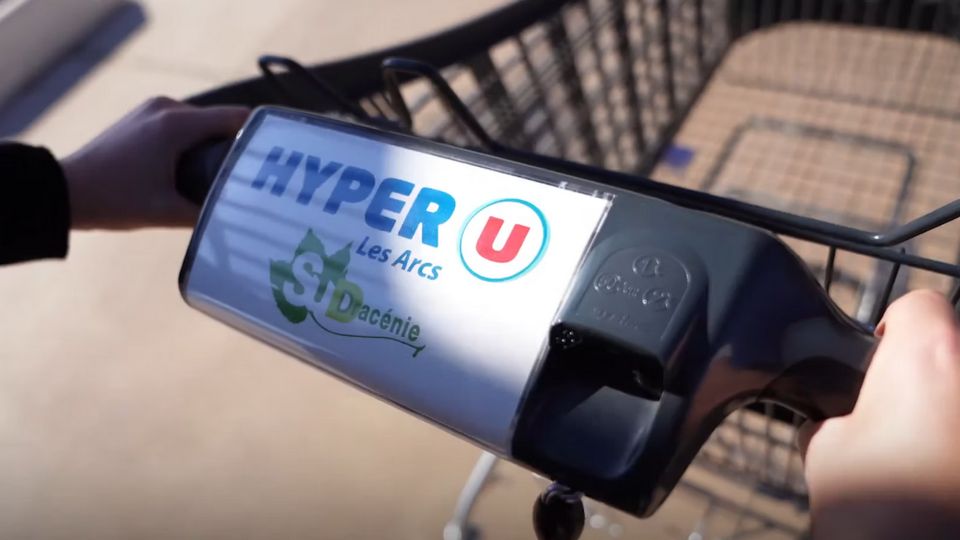 retail customer pushing shopping cart at hyper-u